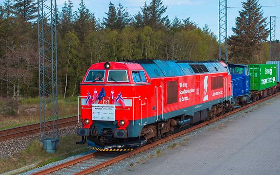 Freight train on trial run to Hirtshals running with Norwegian, Danish and EU flags.