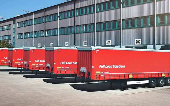 Truck standing at a loading ramp.