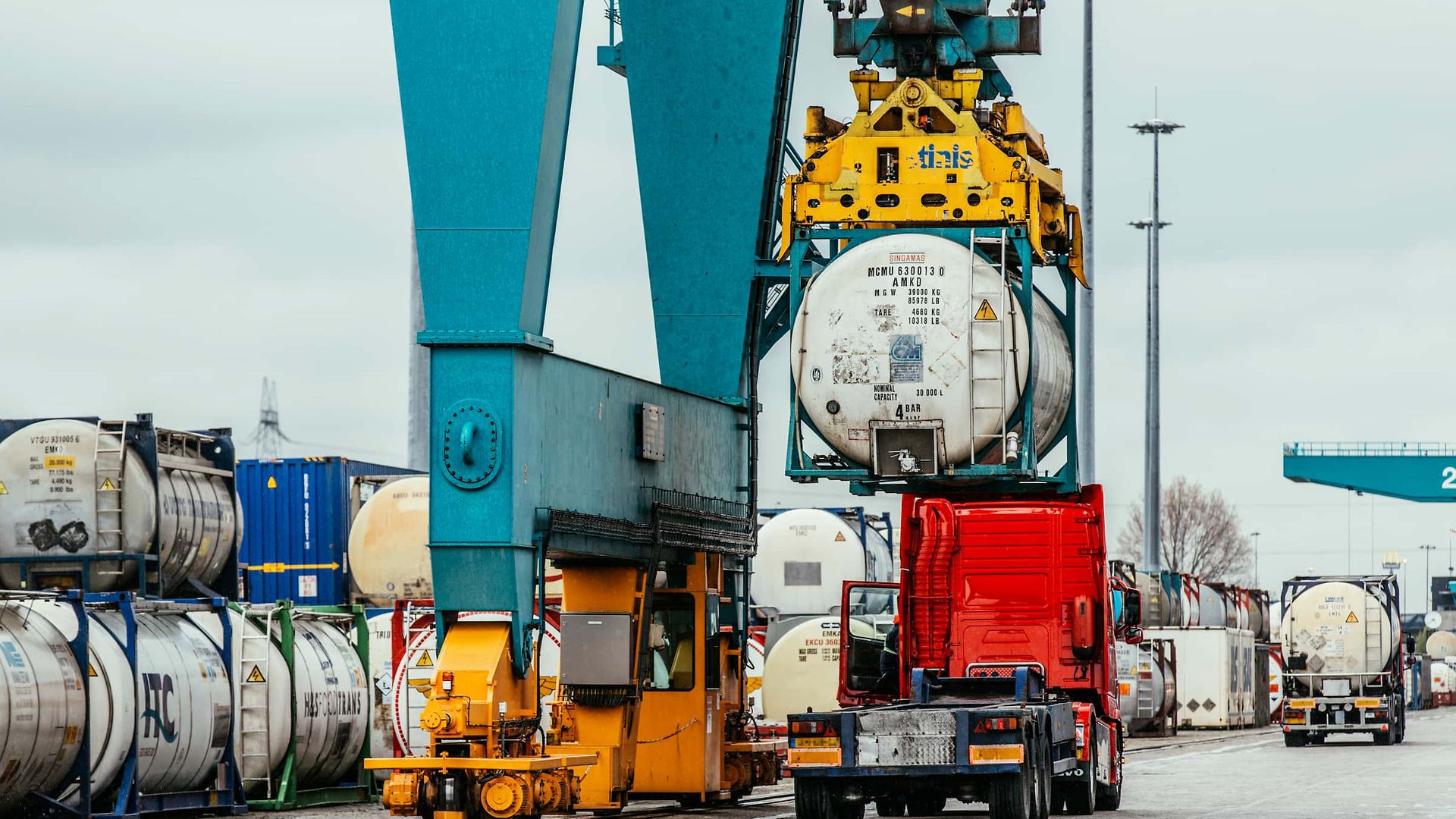 Tank containers are transferred from rail to lorry for the last mile.