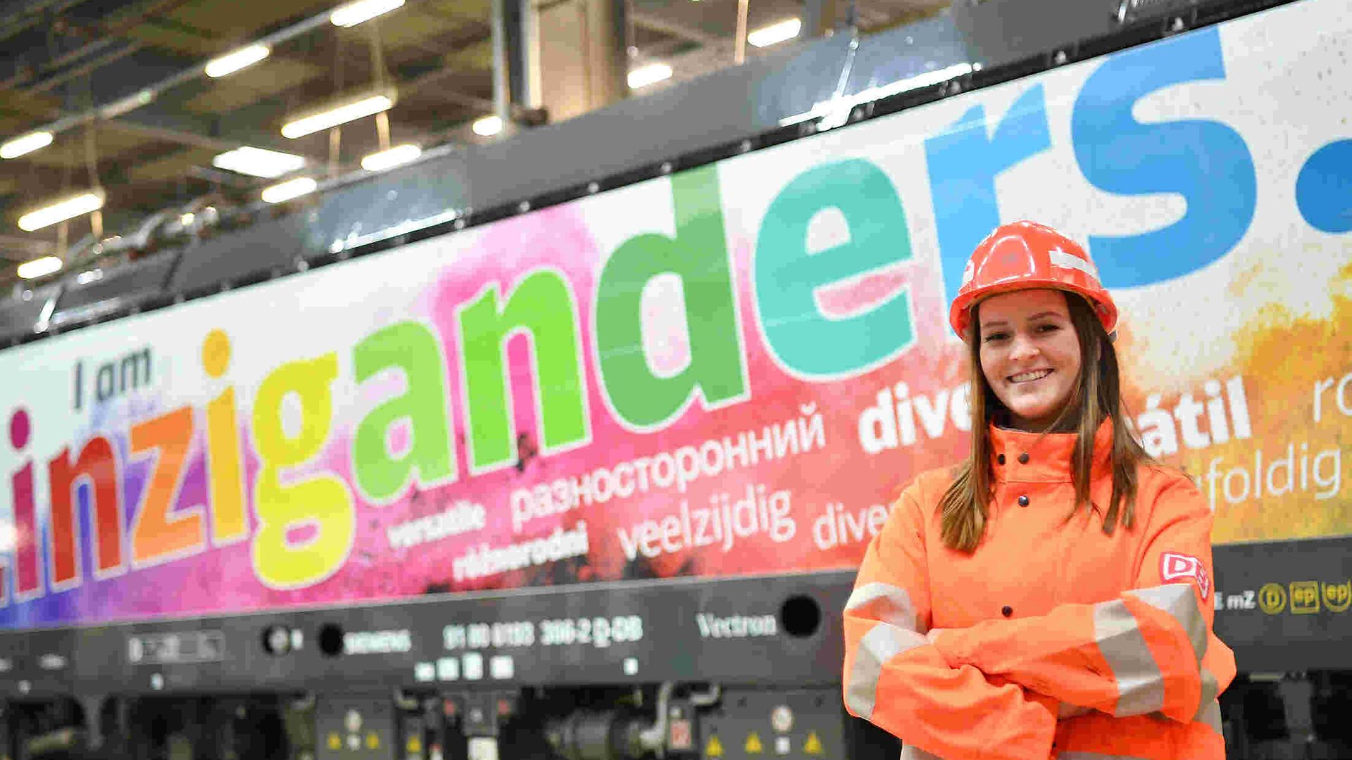 Diversity locomotive with friendly lady in workwear